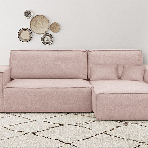 Canapé d'angle convertible réversible 4 places avec coffre de rangement en tissu rose - Livia New